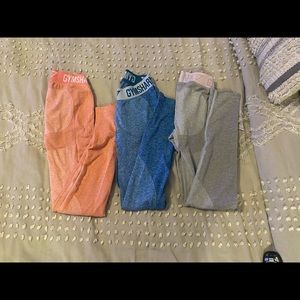 Gymshark workout clothes.3pairs of pants,blue,gray & pink and matching pink top